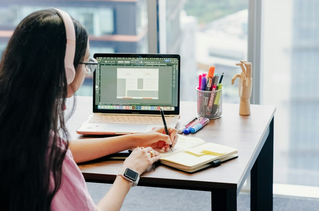woman coding at desk